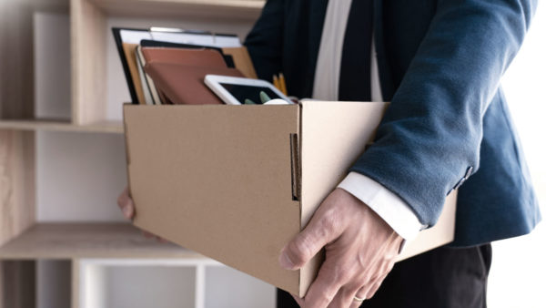 business person carrying a box with their belongings