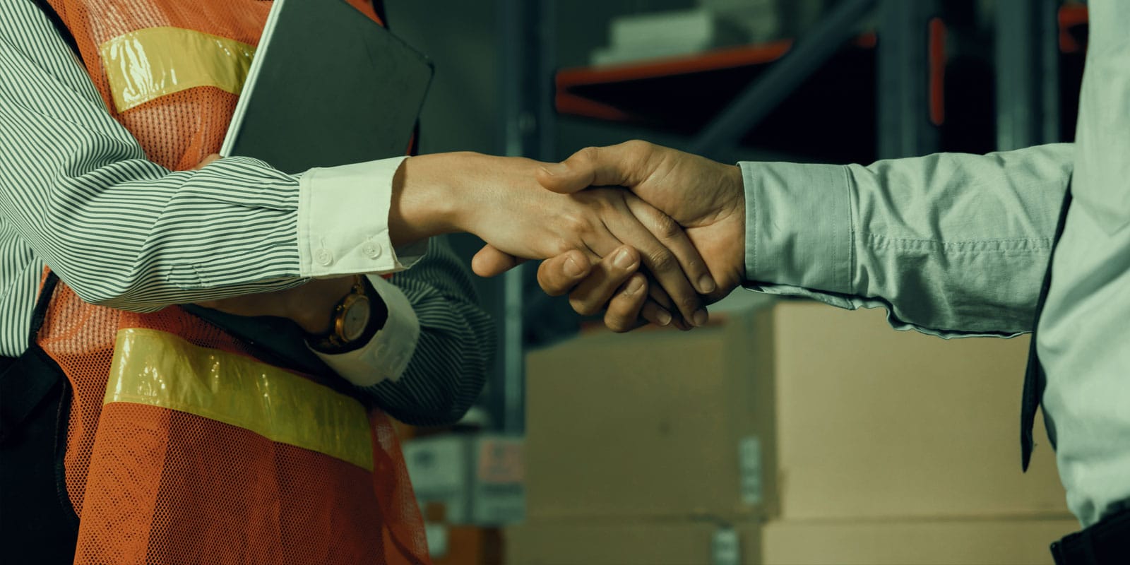 sales person and worker shaking hands