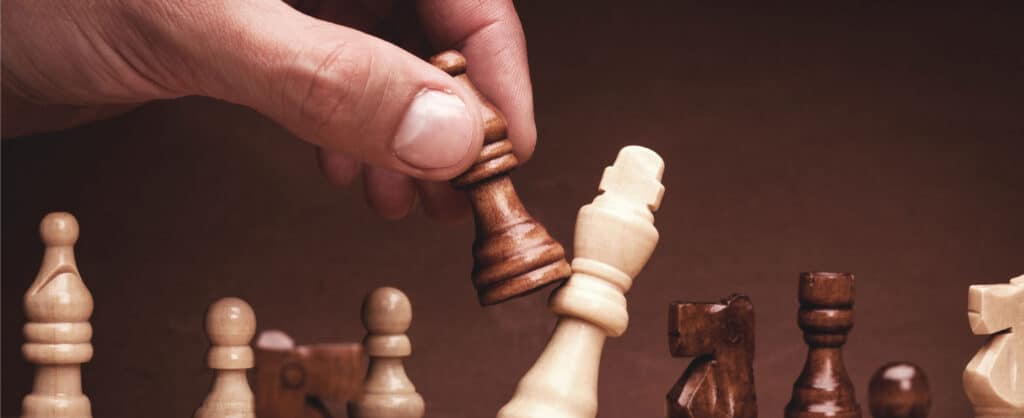 Business person playing chess